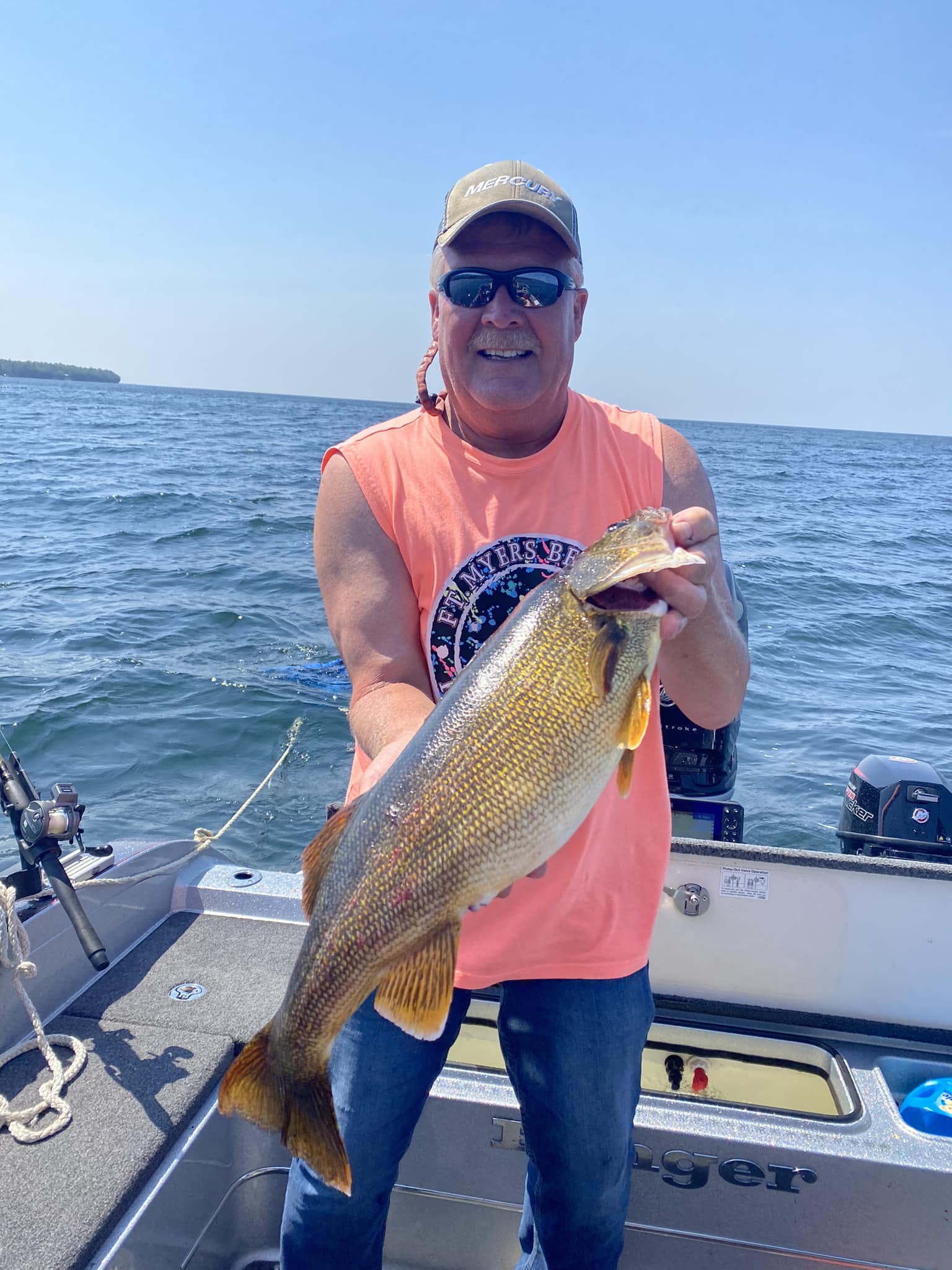 Wayne Butz holding a big walleye on the Great Lakes